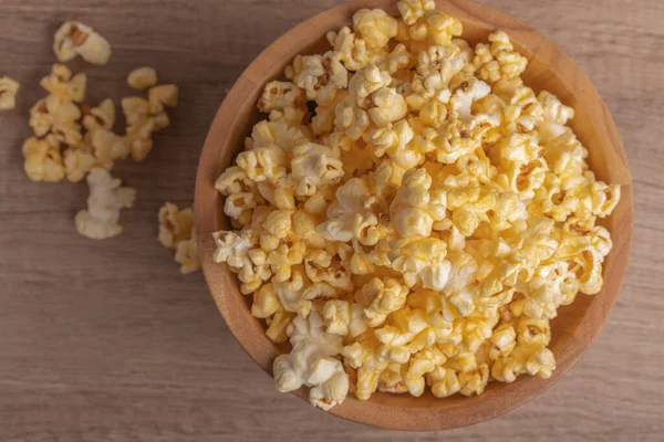 stock image Popcorn in a wooden cup. Snacks.