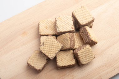 Cube wafer with chocolate cream on isolated white background