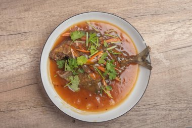 Fried fish with sweet sauce. Top view.