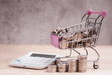 money calculator shopping basket Online shopping finance concept .copy space