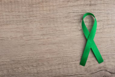 Cancer symbol green ribbon for copy space