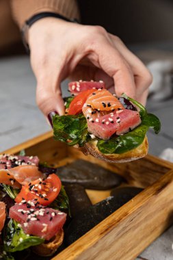 delicious bruschetta with tuna and salmon