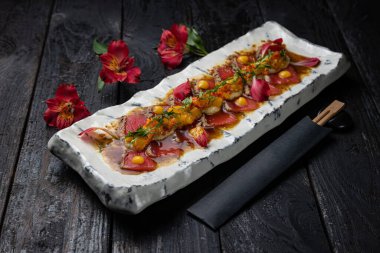 delicious tuna dish on a plate prepared in a restaurant.