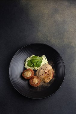 a delicious fish dish on a plate prepared in a restaurant.