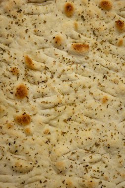 Italian bread - Focaccia, on a wooden table