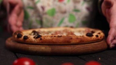 the chef prepares a delicious pizza