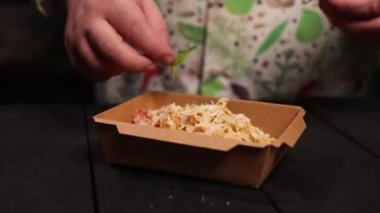 the chef prepares seafood pasta