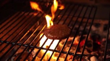 the chef prepares a delicious hamburger from a vegan patty