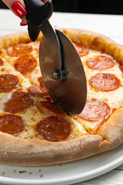 stock image delicious pizza on a white wooden table. close-up