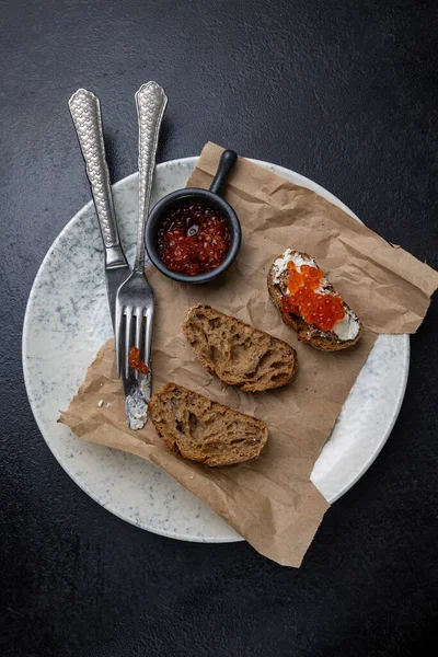 stock image A plate of toasts with red caviar