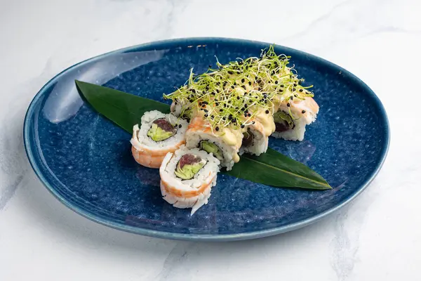 Japanese cuisine. Delicious rolls with tuna and avocado