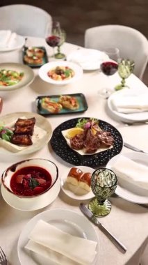 Festive banquet table in a restaurant. Served with delicious dishes. 