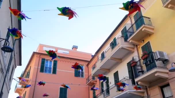Many Very Colorful Pinwheels Spinning Houses City Finale Ligure — Stock Video