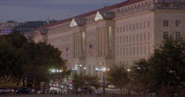 Tourists walk in front of Rossyln Virginia at Night Silhouettes in Washington DC on a beautiful summer night with cars passing by. High quality 4k Footage 