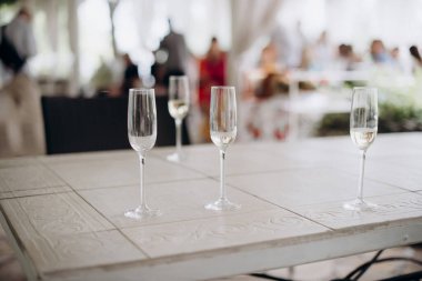 empty glasses and glass of wine