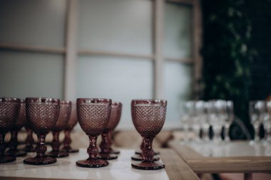 empty glasses and glass of wine