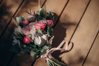 beautiful bouquet flowers and accessories for the wedding ceremony on chair, the concept of beauty