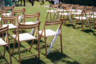 wedding ceremony arch with empty chairs and flowers. beautiful romantic decoration