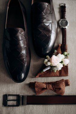 man 's shoes and a man's accessories
