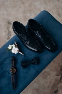man 's shoes and a man's accessories