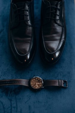 man 's shoes and a man's accessories