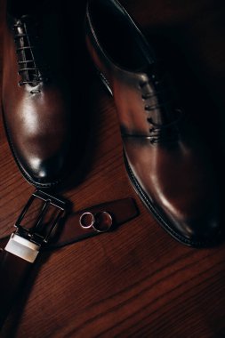 man 's shoes and a man's accessories