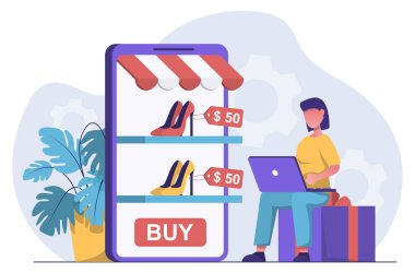 İnternetten alışveriş. İnternetten ayakkabı seçen dizüstü bilgisayarı olan bir kadın.