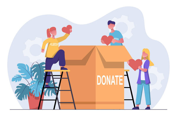Volunteering. A volunteer organization collects humanitarian aid. Volunteers put hearts in a box.