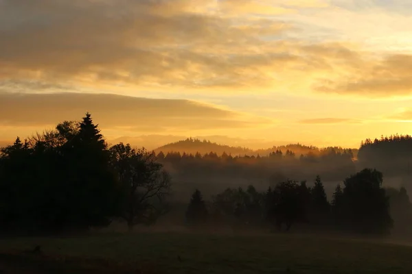 stock image panorama of mountain landscape with morning fog and sunrise