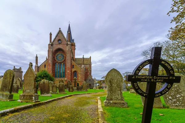 stock image Kirkwall, UK - October 03, 2022: View of the St Magnus Cathedral, and its yard cemetery, in Kirkwall, Orkney Islands, Scotland, UK