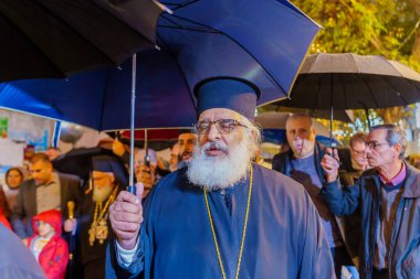 Nazareth, Israel - January 06, 2023: Orthodox Christmas Eve parade, with participants and crowd, in Nazareth, Israel