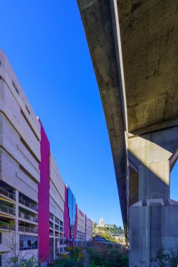 Haifa, Israel - January 20, 2023: View of the Grand Canyon Mall, and an elevated highway (Carmel Tunnels exit), in Haifa, Israel