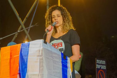 Haifa, Israel - January 28, 2023: Protest leader Rotem Perelman - Farhi speaks to the crowd in a protest against the plans of the new government, claiming its anti-democratic, in Haifa, Israel