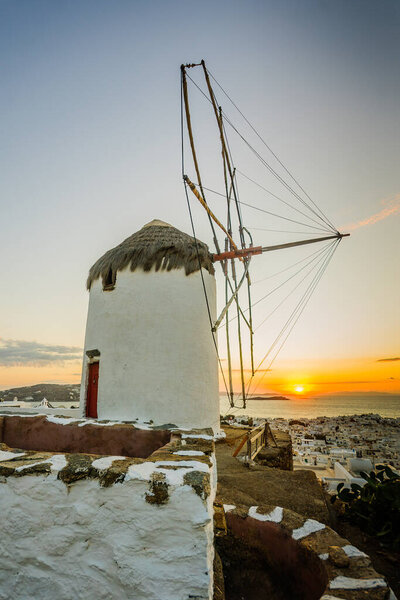 Sunset view of an old windmill, in Mykonos, Mykonos Island, Greece