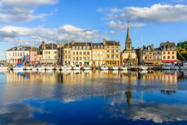 Honfleur, France - September 19, 2012: Scene of Vieux Port (Old Harbor), houses and boats in Honfleur, France. Honfleur is in Calvados, Normandy. It is famous for its old port