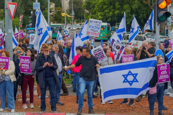 stock image Haifa, Israel - March 23, 2023: Protesters with various signs and flags take part in a nationwide shutdown day, against the plans of the new government, claiming its anti-democratic, in Haifa, Israel