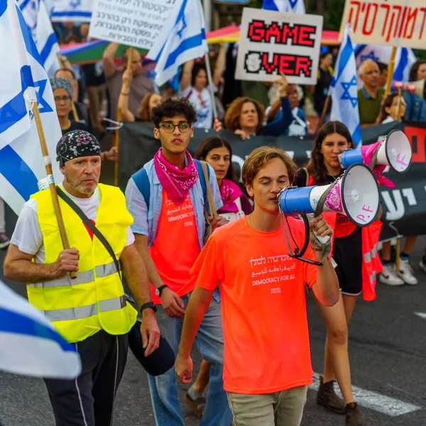 stock image Haifa, Israel - April 22, 2023: Protest march with various banners, signs, and flags as demonstration against the plans of the government, claiming its anti-democratic, in Haifa, Israel