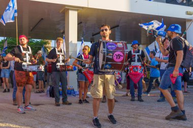 Haifa, Israel - July 20, 2023: People protest with flags and various signs in a government compound. Part of a protest against controversial judicial overhaul, in Haifa, Israel