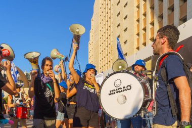 Haifa, Israel - July 20, 2023: People protest with flags and various signs in a government compound. Part of a protest against controversial judicial overhaul, in Haifa, Israel