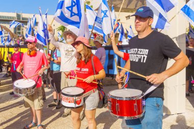 Haifa, Israel - July 20, 2023: People protest with flags and various signs in a government compound. Part of a protest against controversial judicial overhaul, in Haifa, Israel