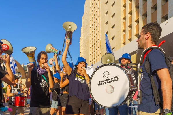 Haifa, Israel - July 20, 2023: People protest with flags and various signs in a government compound. Part of a protest against controversial judicial overhaul, in Haifa, Israel