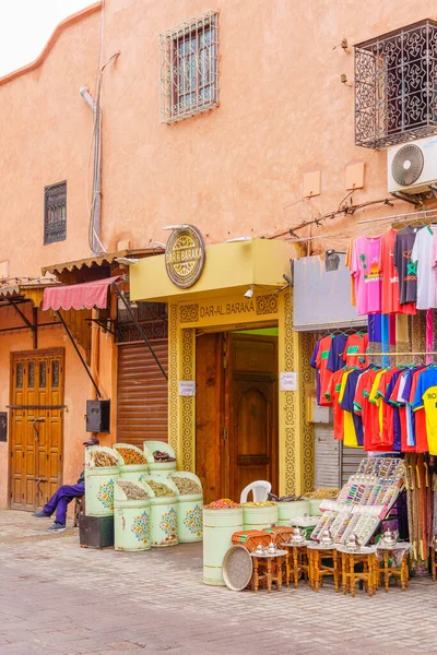 stock image Marrakesh, Morocco - April 05, 2023: View of a street in the Medina, with local shops, in Marrakesh, Morocco