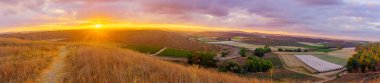 Sunrise panorama of countryside and rolling hills in the Shephelah region, near Lachish, south-central Israel