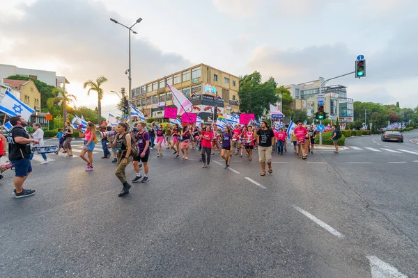 stock image Haifa, Israel - August 19, 2023: People march with various flags and signs. Week 33 of protest against controversial judicial overhaul. Haifa, Israel