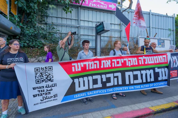 stock image Haifa, Israel - September 02, 2023: People march with anti-occupation banner. Week 35 of protest against controversial judicial overhaul. Haifa, Israel