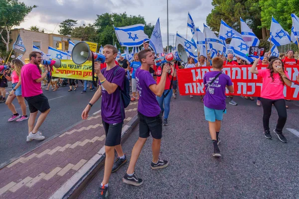 stock image Haifa, Israel - September 02, 2023: People march with various signs and flags. Week 35 of protest against controversial judicial overhaul. Haifa, Israel