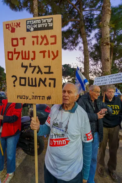 stock image Haifa, Israel - January 06, 2024: People with various signs and flags protesting against the government, calling for taking responsibility of the war and release of hostages. Haifa, Israel