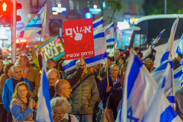 stock image Haifa, Israel - January 06, 2024: People with various signs and flags protesting against the government, calling for taking responsibility of the war and release of hostages. Haifa, Israel