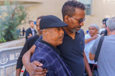 Haifa, Israel - April 02, 2024: Family members of Solomon Teka, and Supporters, after the controversial verdict that acquitted the police officer that shot him dead in 2019. Haifa courthouse, Israel clipart