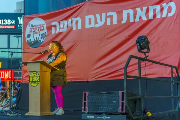 stock image Haifa, Israel - June 15, 2024: Protest leader Gali Eshet Bazak speaks to the crowd, part of a protest march against the government, Haifa, Israel